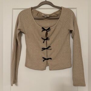 Beige Ribbed Sweater with Black Bow Accents
